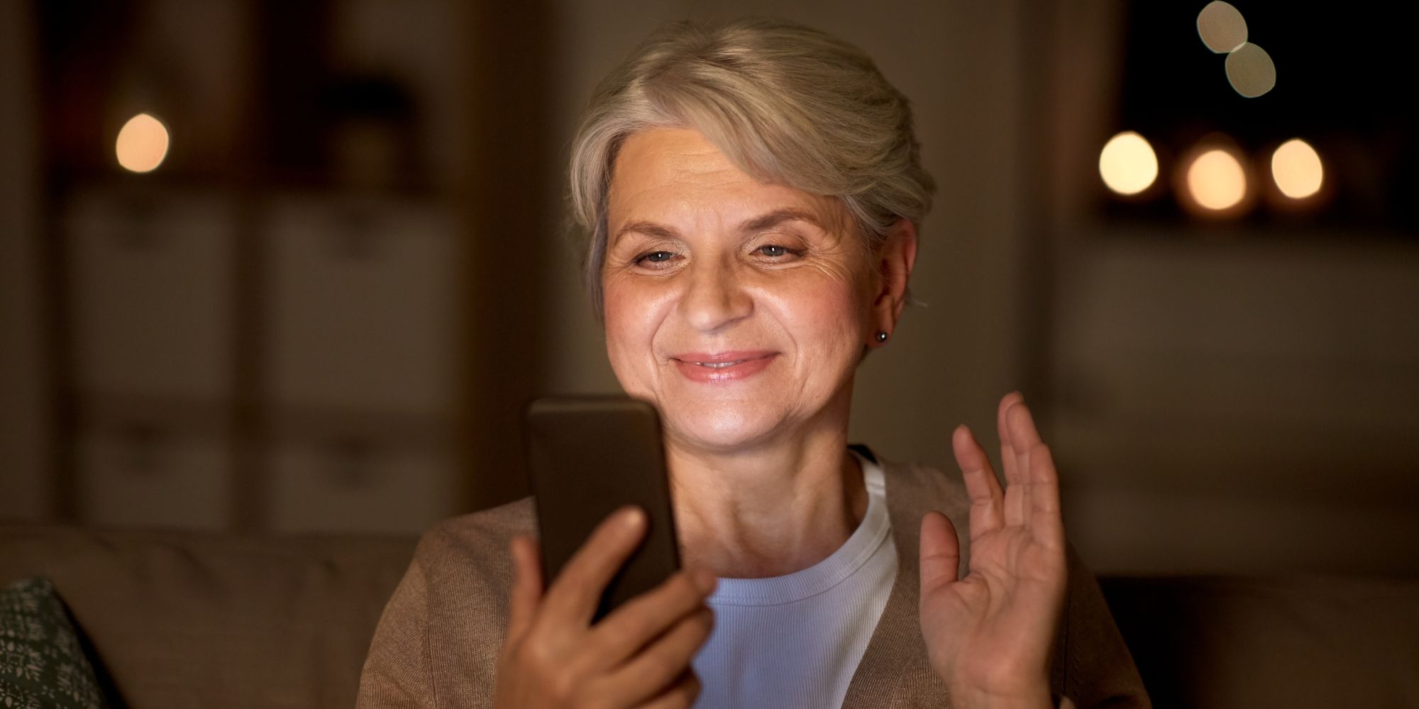 elderly lady looking at a mobile phone best mobile phone for the elderly