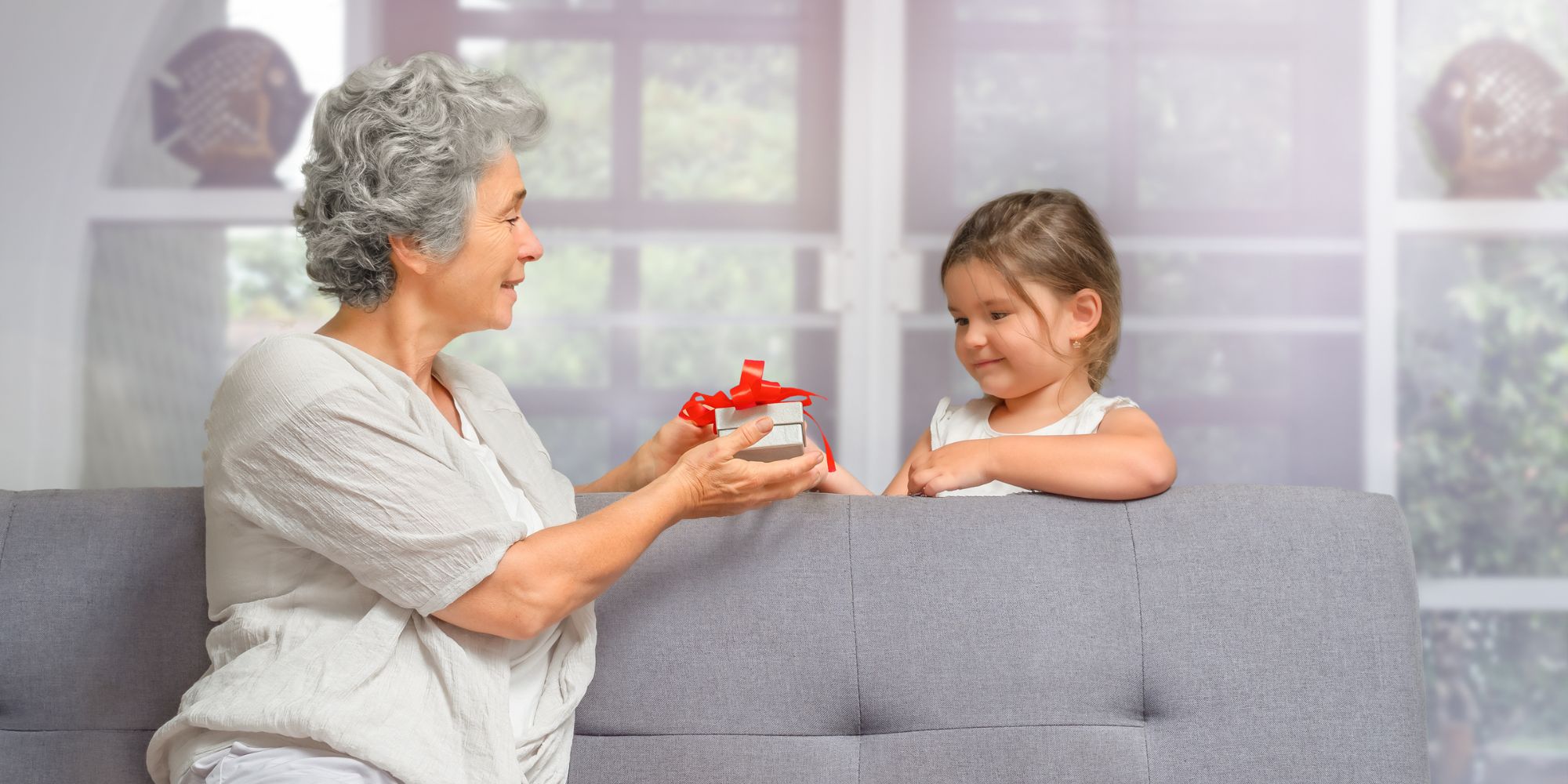 grandchild receiving gift from grandparents choosing gifts for young grandchildren