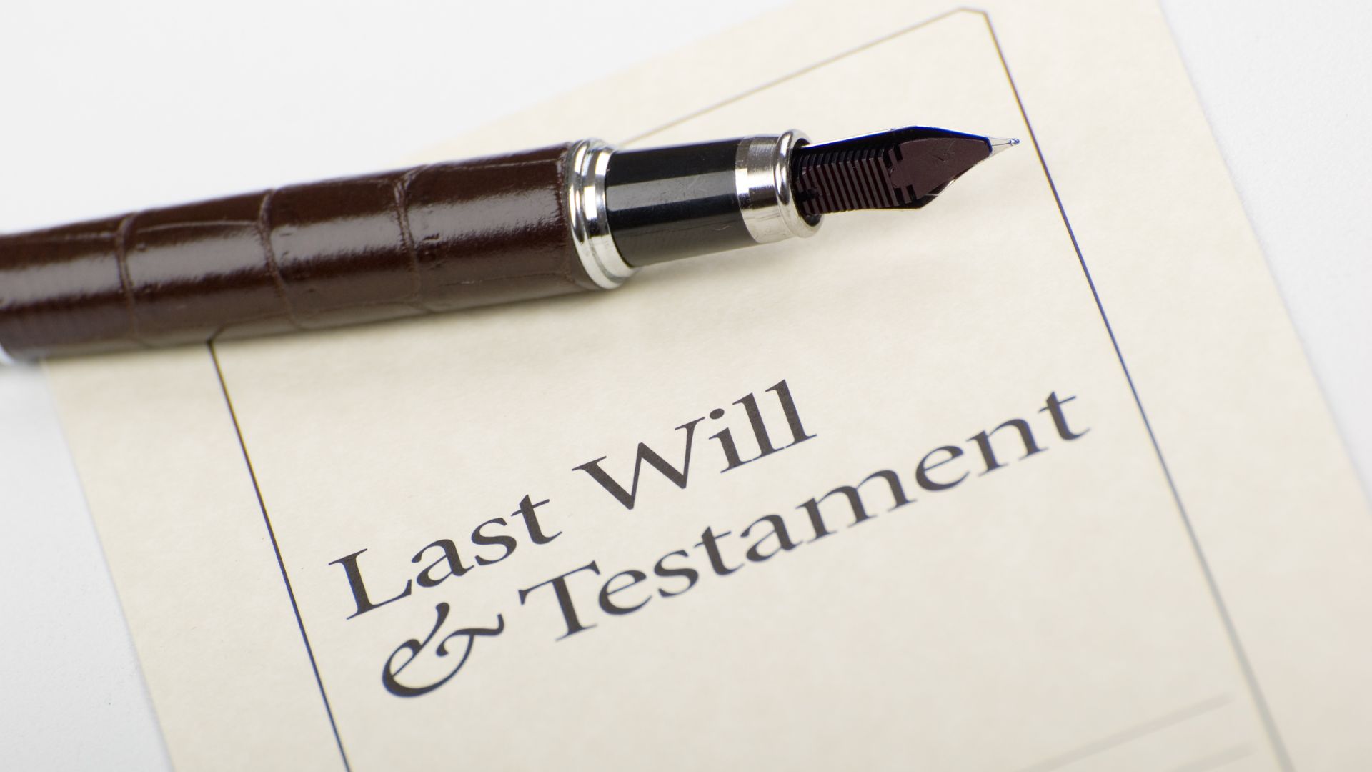 last will and testament document with a pen - wills law reform